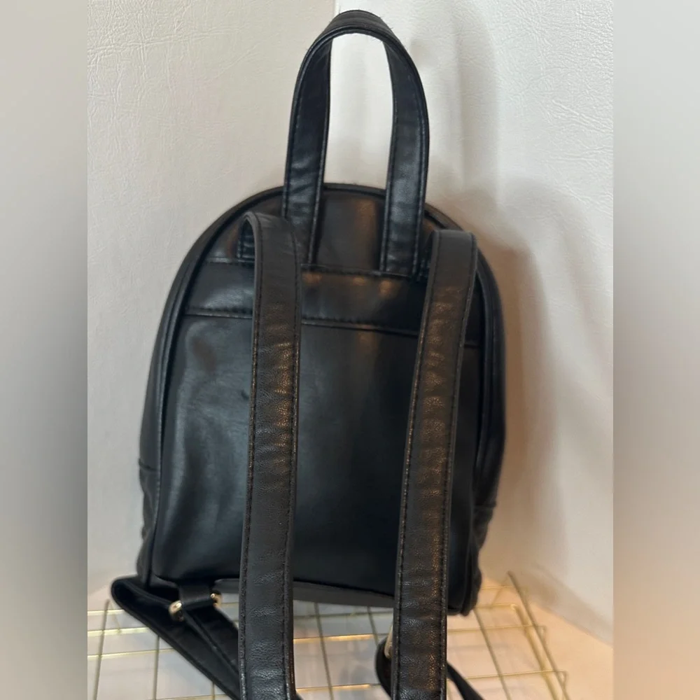 BEBE Black Faux Leather Quilted Mini Backpack Purse with Gold Chain Accent